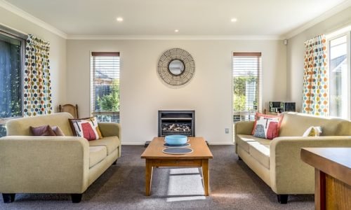 living-room-modern-apartment-with-two-identical-sofas-opposite-each-other_181624-14768